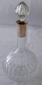 Cut glass carafe with silver neck Cut glass carafe with silver neck